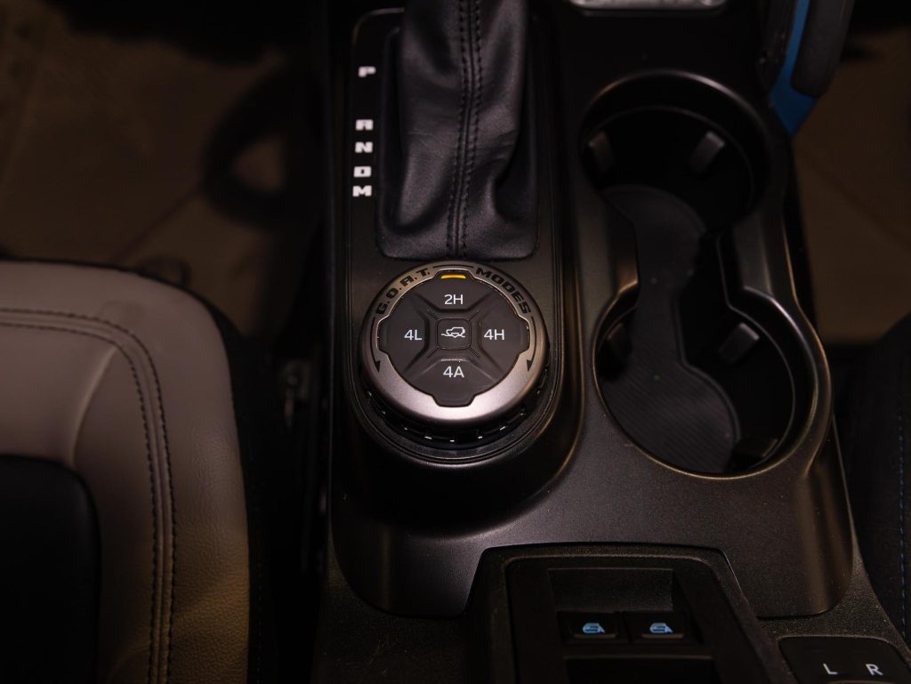 Four-wheel drive selector knob in a vehicle's center console. - Monarch Showroom