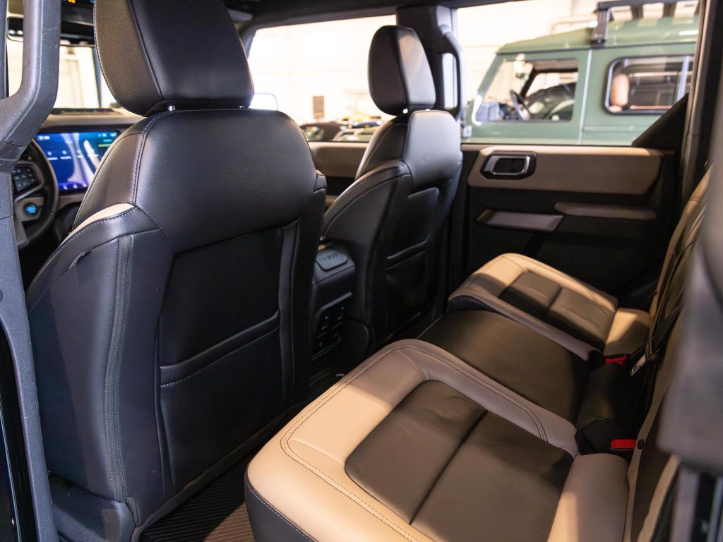 Luxurious car interior featuring leather seats and modern design. - Monarch Showroom