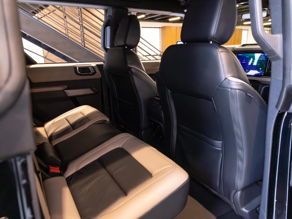 Interior view of a modern vehicle showcasing its leather seats and dashboard. - Monarch Showroom