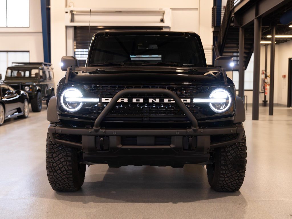 Black ford bronco with aftermarket modifications parked indoors. - Monarch Showroom