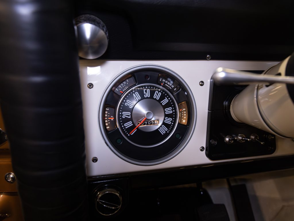 Classic car speedometer showing 0 mph and odometer at 07058 miles. - Monarch Showroom
