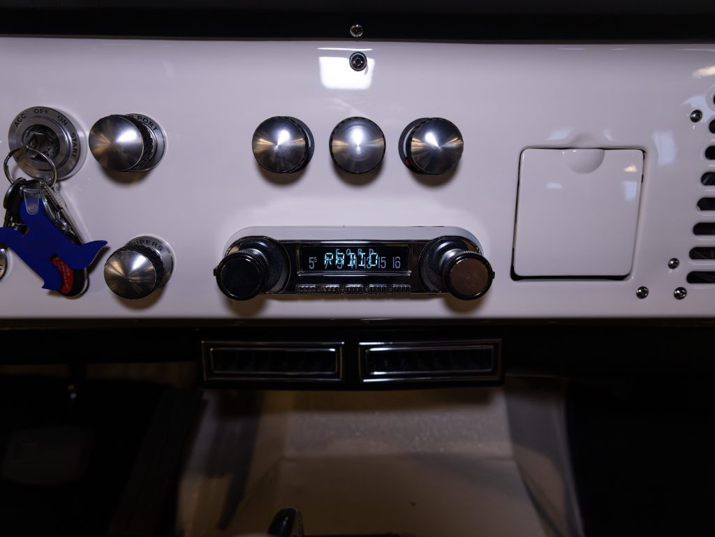 Control panel of a coffee machine with dials and digital display indicating the temperature. - Monarch Showroom