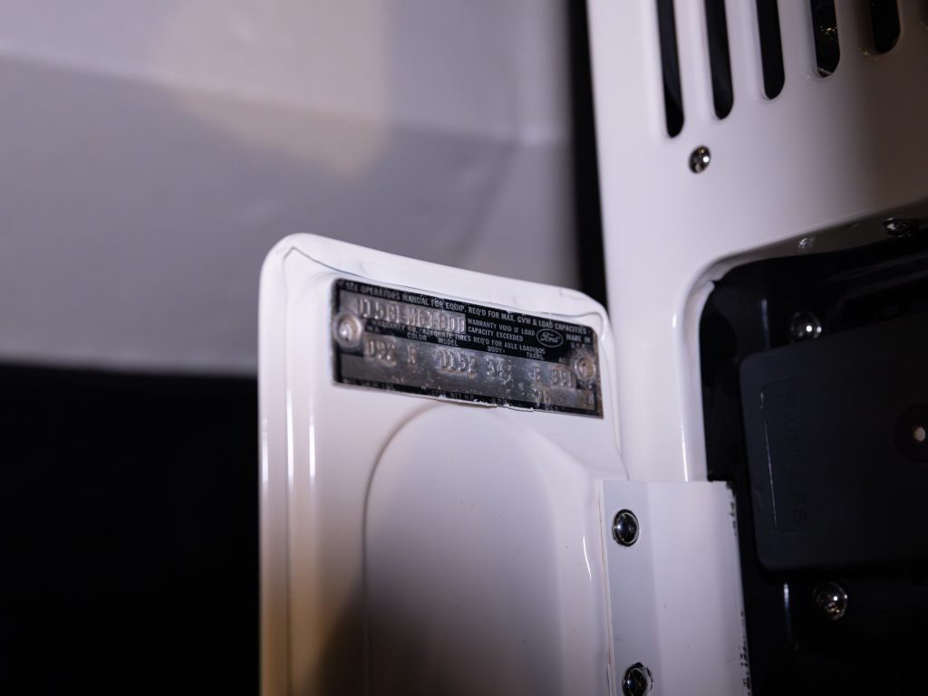 A close-up of a data plate on a piece of machinery, showing technical specifications and model information. - Monarch Showroom