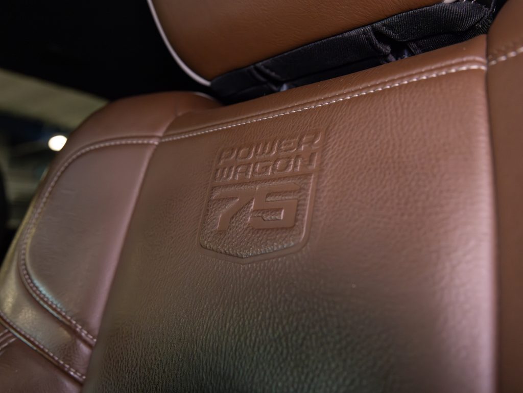 Leather car seat embossed with "power wagon 75" logo. - Monarch Showroom